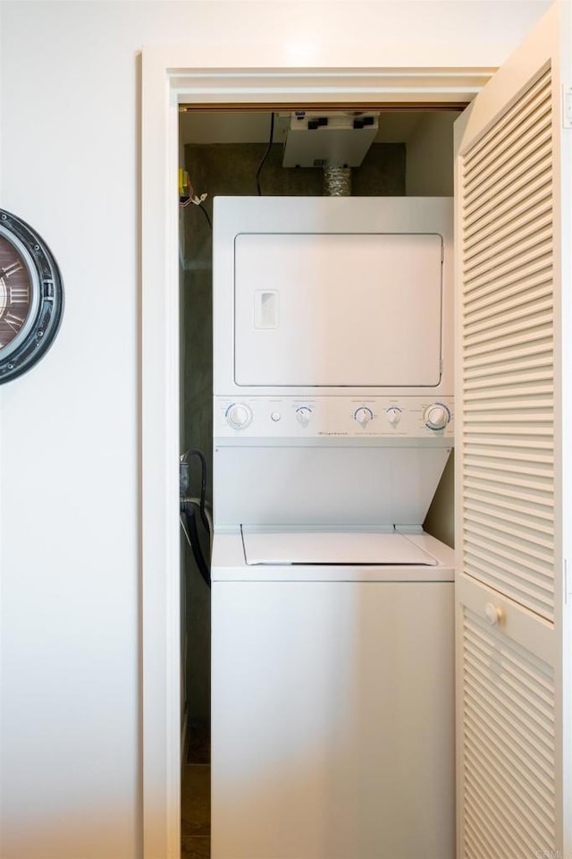 laundry room featuring stacked washer and dryer