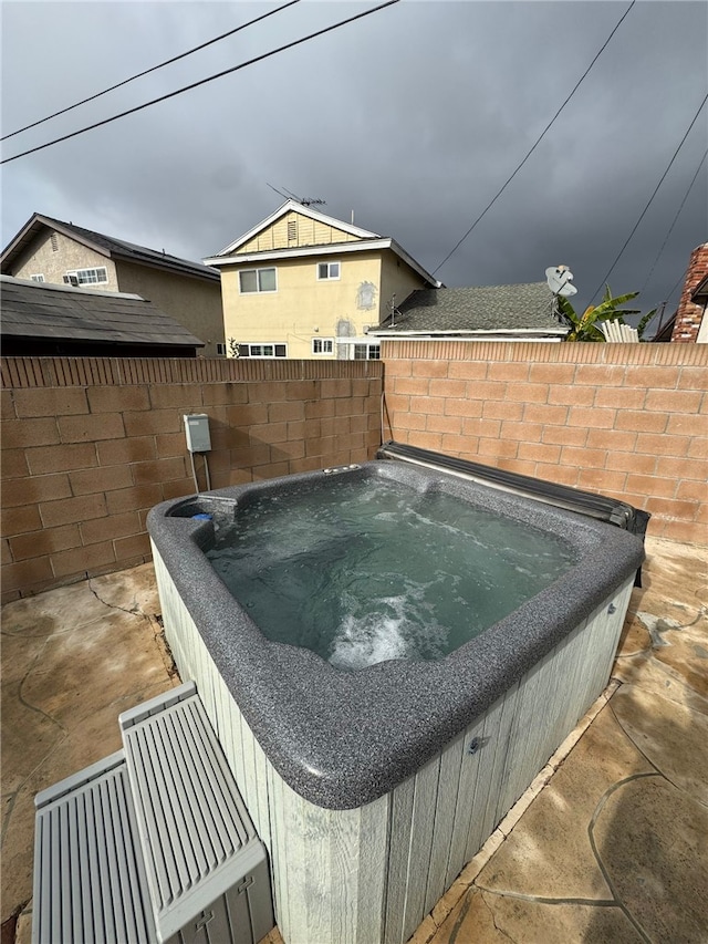 view of pool featuring a hot tub