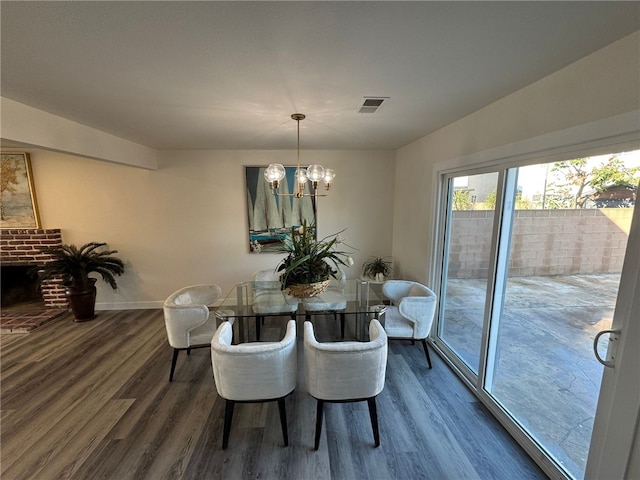 dining room featuring an inviting chandelier and dark hardwood / wood-style floors