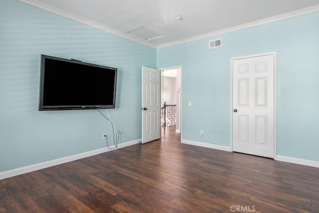 unfurnished bedroom with dark hardwood / wood-style flooring and ornamental molding