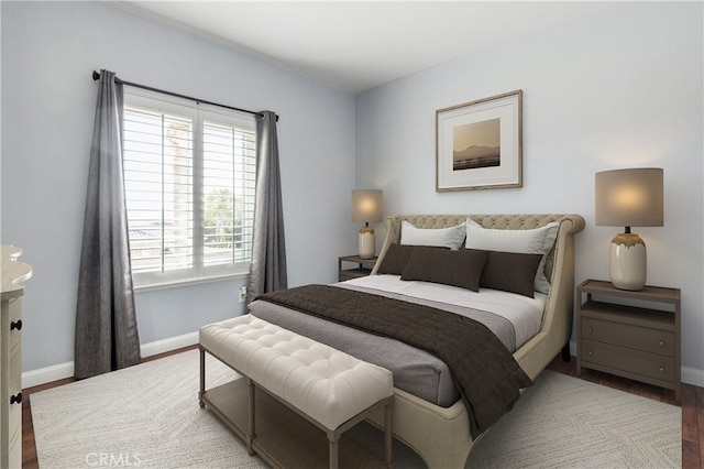 bedroom with hardwood / wood-style flooring