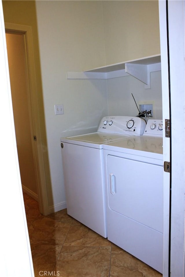 laundry area with independent washer and dryer