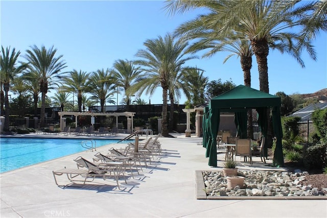 view of swimming pool with a patio area