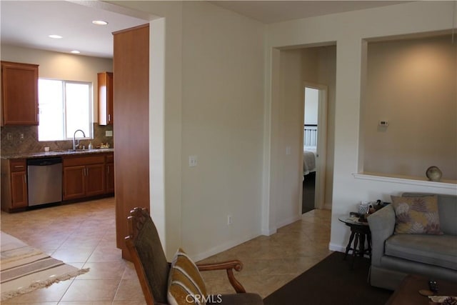 tiled living room featuring sink