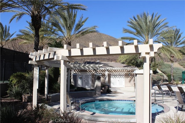 view of swimming pool with a patio and a pergola