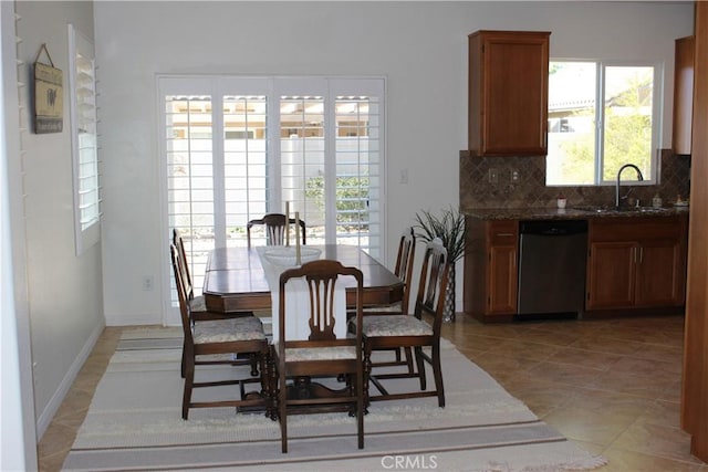 tiled dining area featuring sink