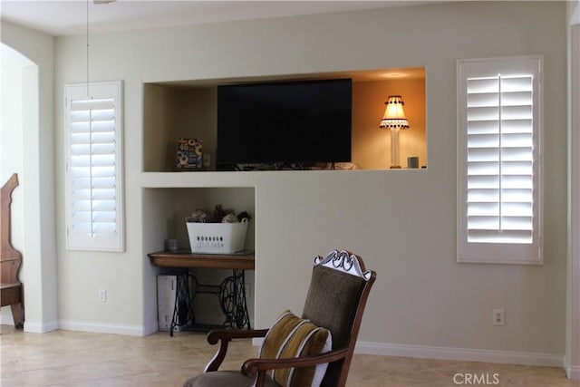 living area with light tile patterned floors