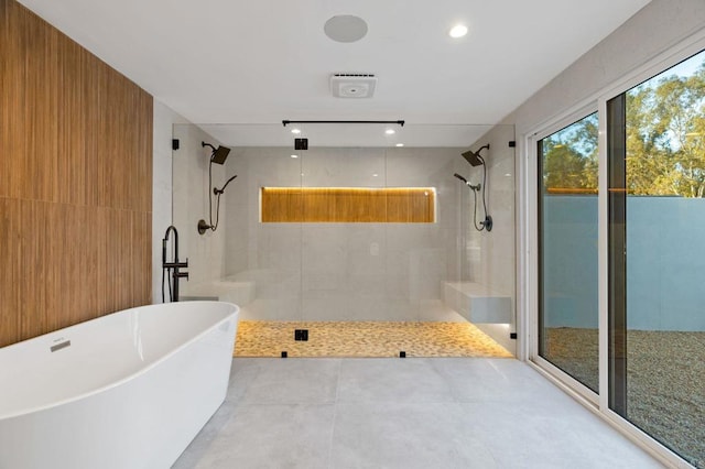 bathroom with shower with separate bathtub