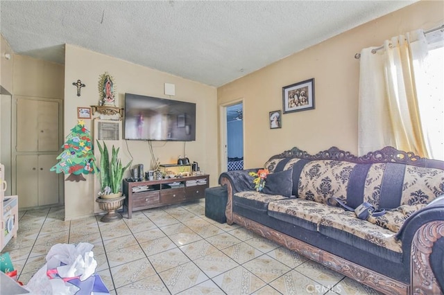 tiled living area featuring a textured ceiling