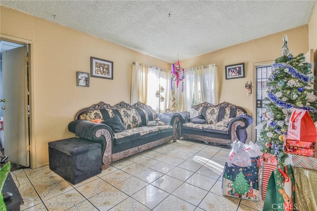 tiled living area featuring a textured ceiling