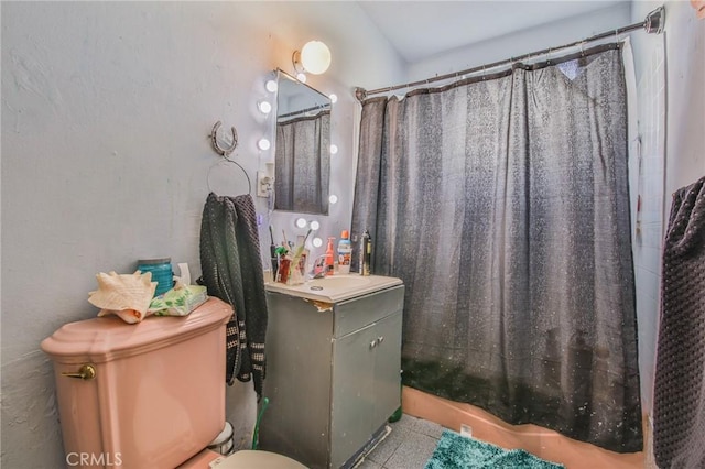 bathroom featuring toilet, a shower with curtain, and vanity