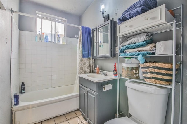 bathroom with toilet, tile patterned flooring, shower / bath combo, and vanity