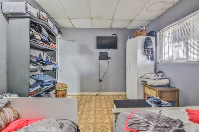 bedroom with a paneled ceiling