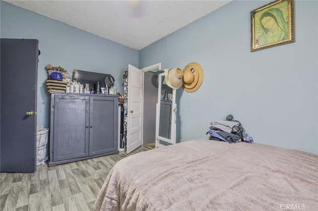 bedroom featuring ceiling fan and wood finished floors