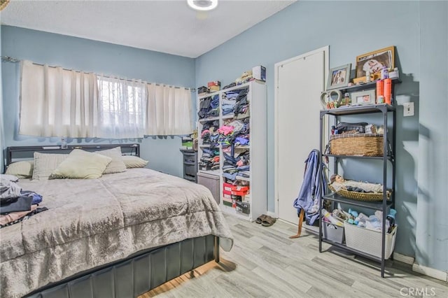 bedroom with wood finished floors