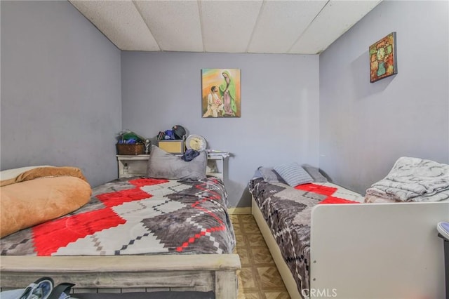 bedroom featuring a paneled ceiling