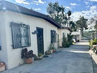 view of side of property with stucco siding