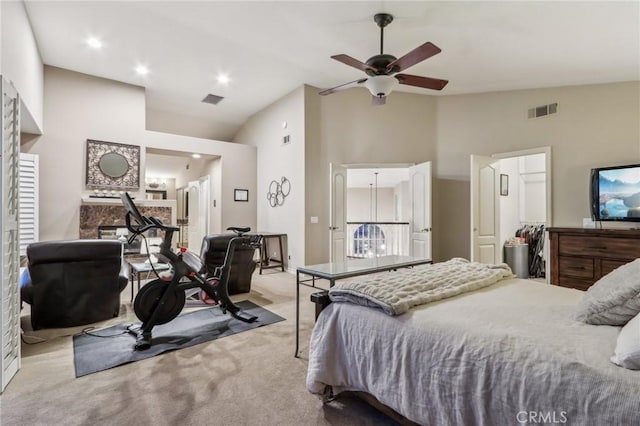 bedroom featuring light carpet, high vaulted ceiling, and ceiling fan