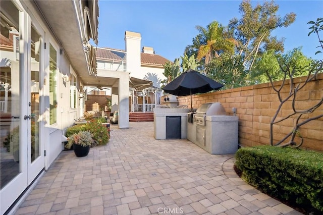 view of patio / terrace featuring french doors, area for grilling, and grilling area