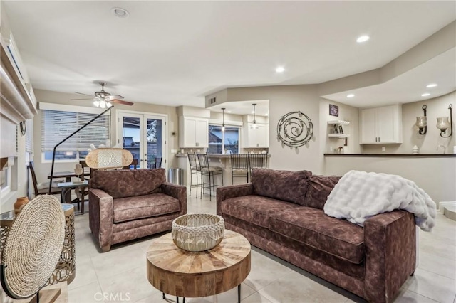 living room featuring light tile patterned floors, french doors, a ceiling fan, and recessed lighting