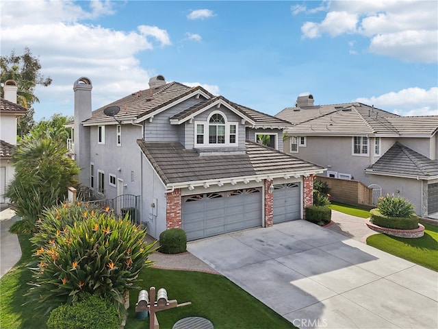 traditional home featuring driveway, brick siding, and a tile roof