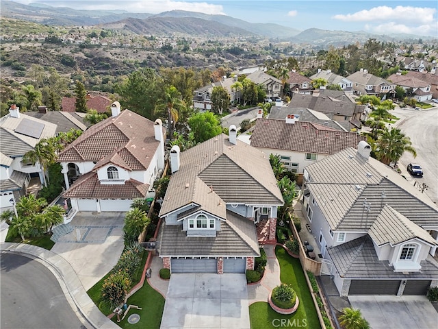 drone / aerial view with a mountain view and a residential view