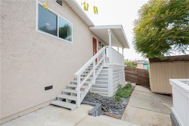 view of property exterior with a patio area