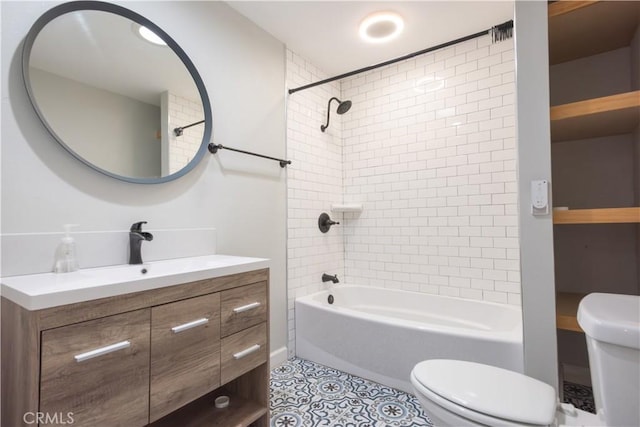 full bathroom with toilet, vanity, tile patterned flooring, and tiled shower / bath