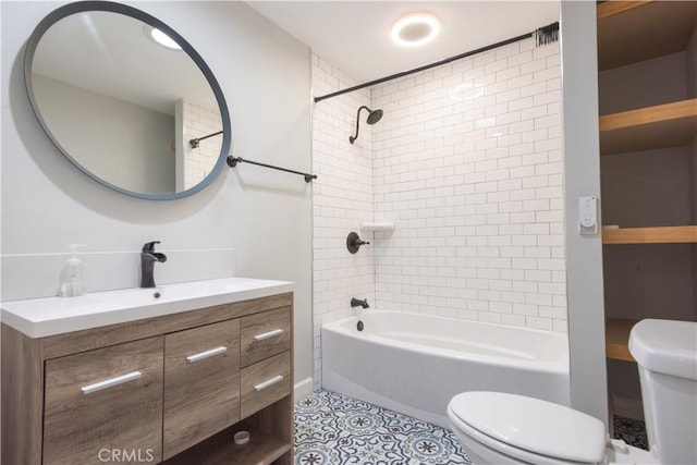 full bathroom with toilet, vanity, tiled shower / bath combo, and tile patterned flooring