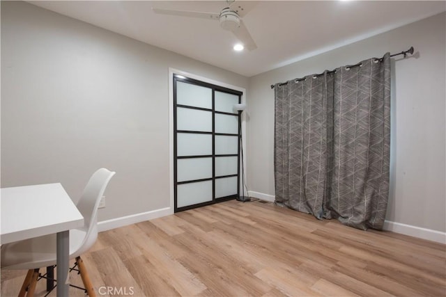 unfurnished office featuring ceiling fan and light hardwood / wood-style flooring