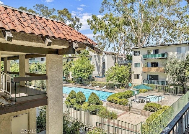 view of swimming pool with a patio