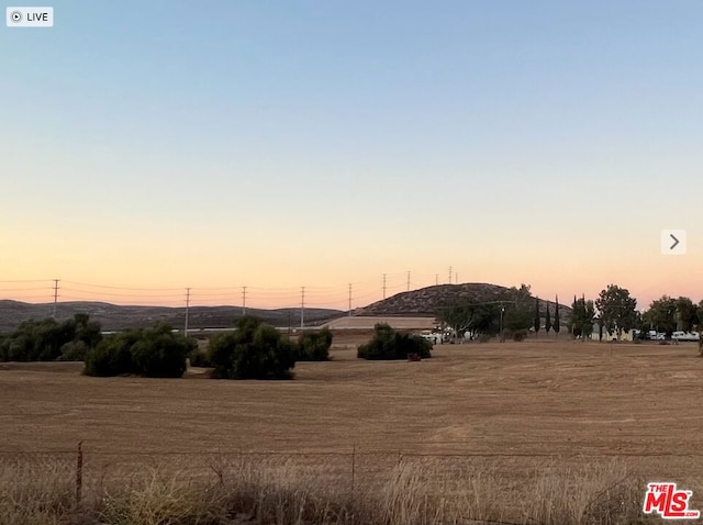 view of yard at dusk