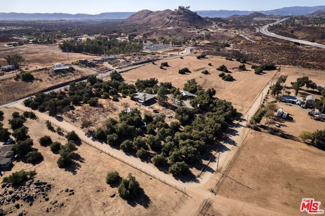 birds eye view of property featuring a mountain view