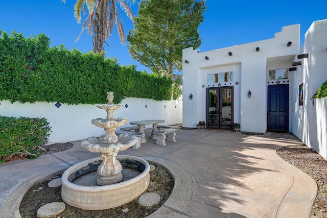 view of patio featuring french doors