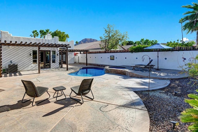 view of pool with an in ground hot tub, a patio, a mountain view, a pergola, and central air condition unit