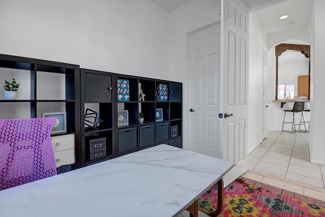 bedroom with light tile patterned floors