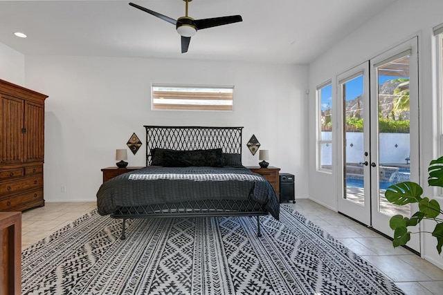 bedroom featuring ceiling fan, french doors, access to exterior, and multiple windows