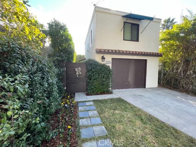 view of side of home with a garage