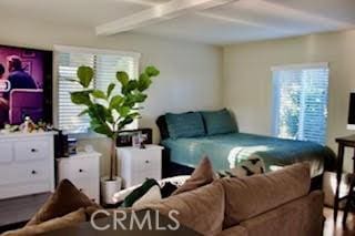 bedroom featuring beam ceiling