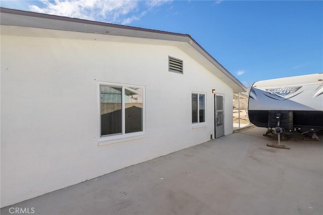 view of home's exterior with a patio