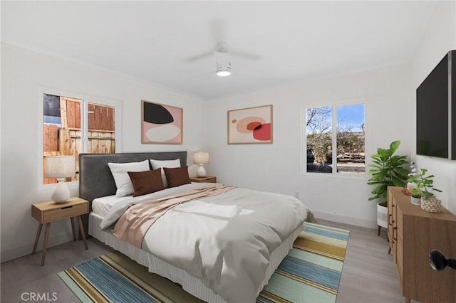 bedroom featuring ceiling fan and light wood-type flooring