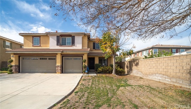 view of front of property featuring a garage