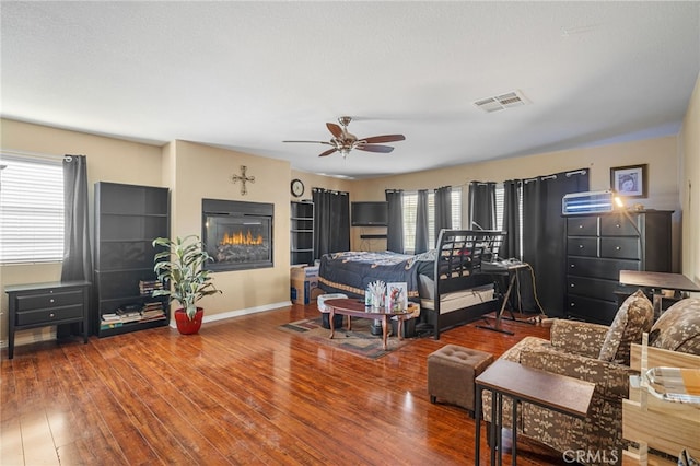 bedroom featuring hardwood / wood-style flooring and ceiling fan