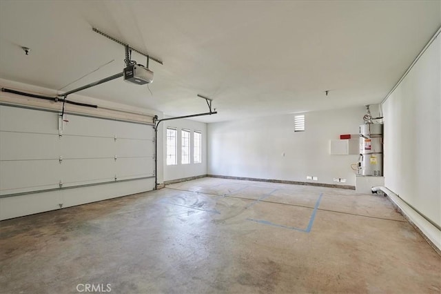 garage featuring secured water heater and a garage door opener