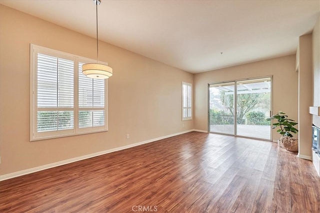 unfurnished room featuring hardwood / wood-style flooring