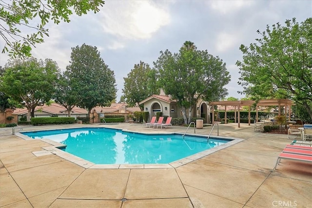 view of pool featuring a patio area and a pergola