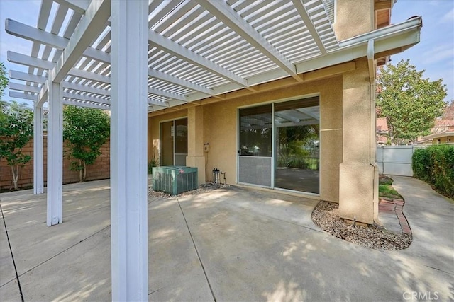 view of patio / terrace with central air condition unit, fence, and a pergola