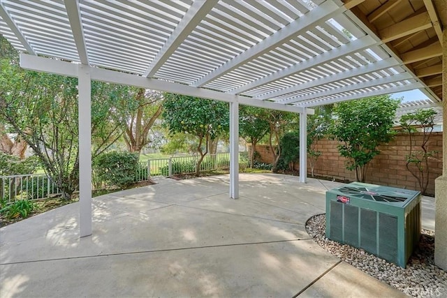 view of patio with cooling unit and a fenced backyard