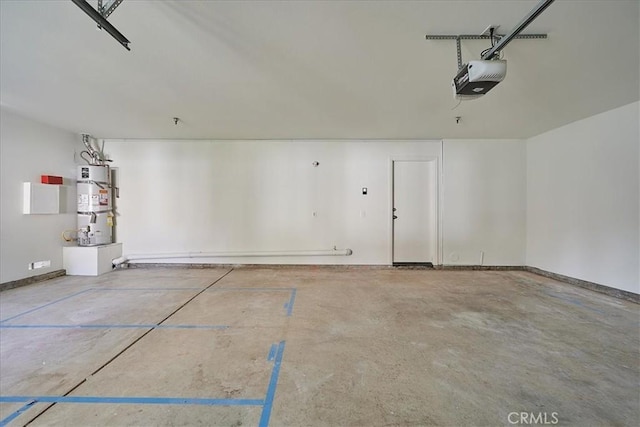 garage featuring water heater, baseboards, and a garage door opener