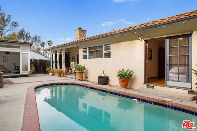 rear view of property with a patio area